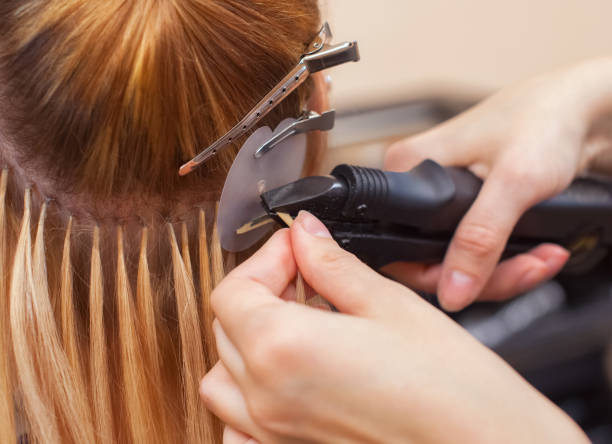 A true stylist gives his client a classy hairstyle with hair extensions from colored hair post thumbnail image